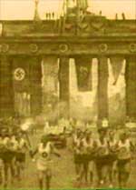olympic torch at the brandenberg gate 1936